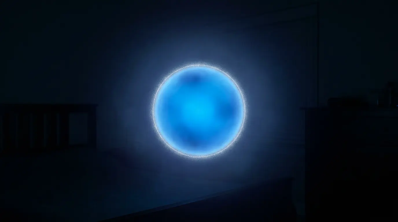 concentrated blue light sphere floating in a dark room, evoking the yogic spiritual eye or Kutastha in a nighttime bedroom setting