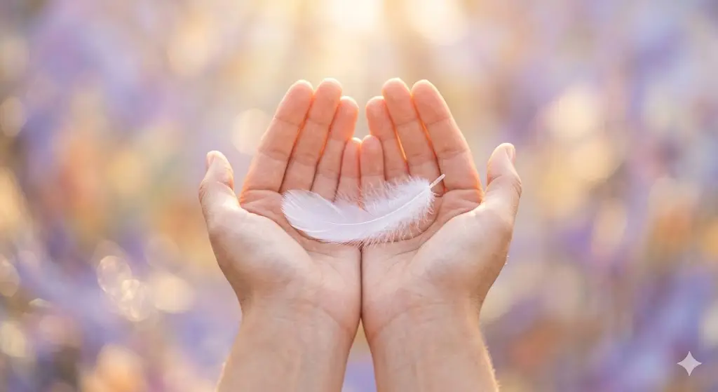  Close-up of hands gently holding a white feather in a dreamy ethereal setting