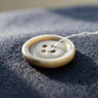 Finding a Button in a Strange Place: What Closure and Connection Could Represent finding-a-button-spiritual-meaning.webp