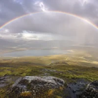 rainbow appearing in a clearing post-rain sky, representing seeing a rainbow after praying meaning