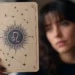 printed zodiac sun-sign card held in front of a blurred face that doesn't match it, illustrating the question why don't I relate to my zodiac sign