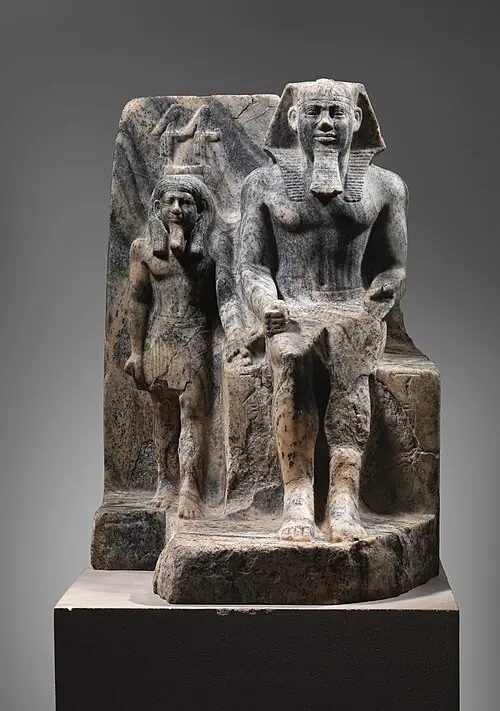 Divine figure offering an ankh to King Sahure