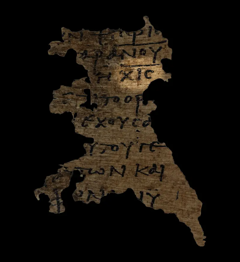 Torn papyrus fragment on a black background showing seven lines of Greek uncial script, with the letters chi iota stigma on the third line