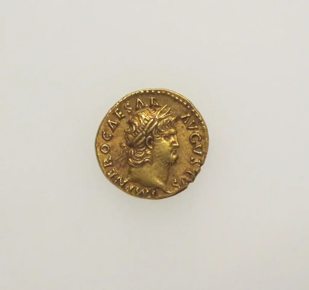 Roman gold aureus showing a laureate profile portrait of the emperor Nero facing right, with a Latin legend around the rim